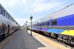 Two Amtrak San Joaquin Trains sitting opposite each other at BFD Station